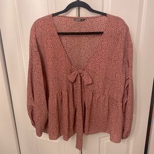 Pink polka dotted top with bow detail